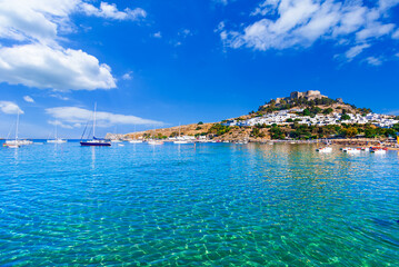 Lindos, Rhodes, Greece: Scenic view of Lindos Acropolis and beach on Rhodes island, Aegean Sea
