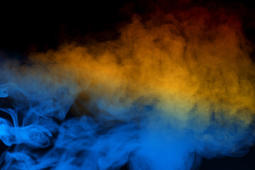 Fototapeta premium Blue steam on a black background.
