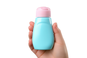 hand holding blue lotion bottle with pink cap isolated on white background