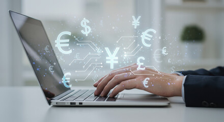 Currency exchange online: A man types on a laptop, connecting to the global economy with Euro, Yen, Dollar, and Pound icons overlaid on a digital interface.