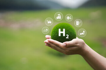 Hand Holding Green Hydrogen Sphere Symbolizing Clean Energy Future