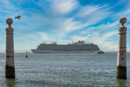 View into land of a Luxury Cruise Ship sailing out of Lisbon harbour, Portugal