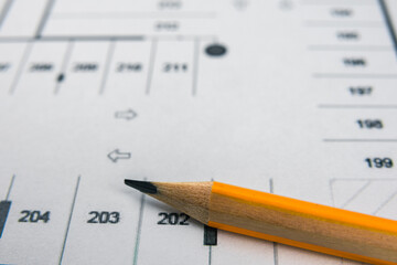 Close up graphite pencil and house blueprint