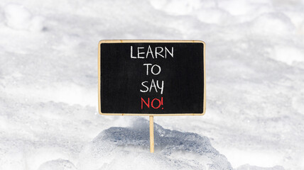 Learn to say no symbol. Concept words phrase Learn to say no on beautiful black blackboard....