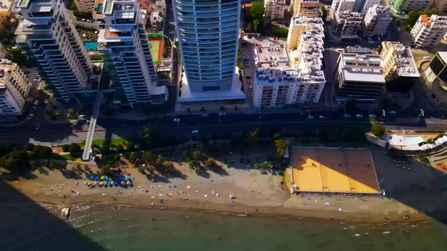 Evening sunset over Limassol, Cyprus. Aerial view of modern urban architecture and glass skyscrapers of Cyprus. Mediterranean Sea near Limassol, Cyprus. High quality footage 4k