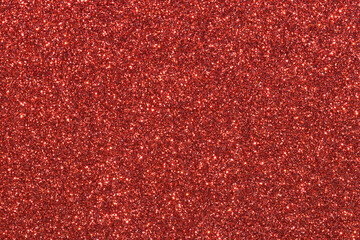 A red background with glittery red dots