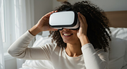 Woman in her 30s enjoys a virtual reality experience indoors with VR headset, smiling and exploring new digital world.