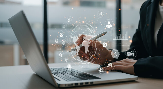 Digital Transformation: A business professional in a black blazer visualizes global connectivity and data analytics on a laptop.