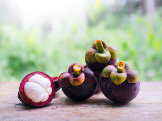 Ripe mangosteen on wooden table. Queen of fruits in Thailand