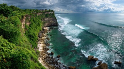 Obraz premium Dramatic coastal cliffs meet the ocean waves.