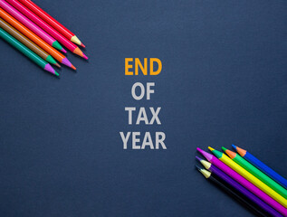 End of tax year symbol. Concept words phrase End of tax year on beautiful black paper. Colored...