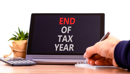 End of tax year symbol. Concept words phrase End of tax year on beautiful black tablet....