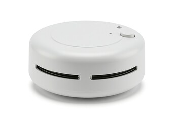 White circular device, likely a smoke detector, with dark lines
