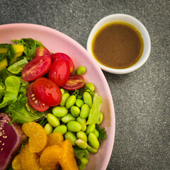 A colorful salmon salad plate.