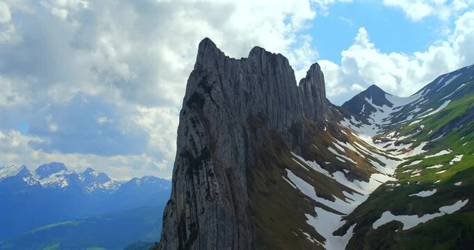 Explore stunning mountain peaks and breathtaking landscapes in the scenic region during a sunny day of adventure