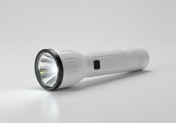 White flashlight on a light gray surface