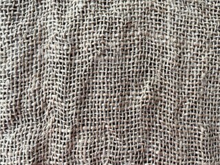 Natural jute texture as background. Jute fabric background and texture, the main material is made of plant fibers, which are made of yarn for fiber. Close-up of light color bag textured background.