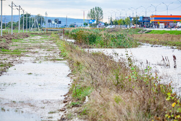 Flooded field after a rainstorm . Inundation in village after rain 