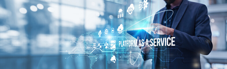PaaS. Businessman using tablet analyzing Platform as a Service and cloud-based solutions to support scalable growth, streamline development, and improve deployment efficiency.