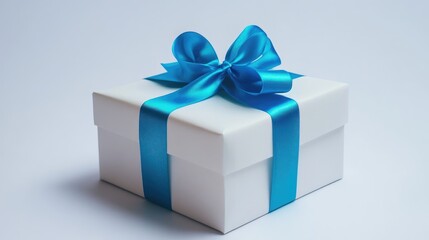 Obraz premium White gift box with blue ribbon on white background