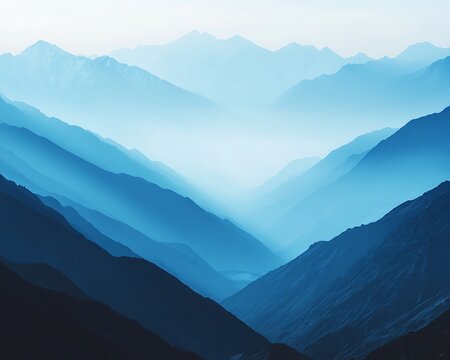 An aerial view showing layered mountain ranges covered in mist