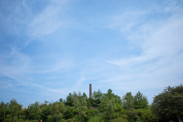 Brickworks Chimney Against Blue Sky