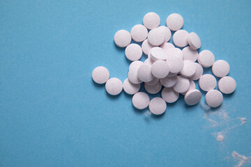 Vitamins for hair, skin and nails on the blue background. Health