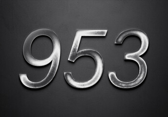 Chrome metal 3D number design of 953 on grey background.