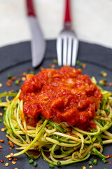 Zucchini spaghetti with dehydrated pepperoni pepper and red sauce