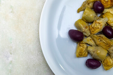 Portion of artichoke hearts and olives