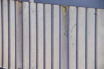 Close-up of metal corrugated board. Fence from corrugated board. Texture of metal fence. For background use.