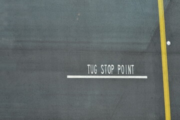Looking from the top of the sign of Tug stop point at the airport. Traffic sign. Transportation concept.