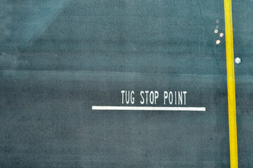 Looking from the top of the sign of Tug stop point at the airport. Traffic sign. Transportation concept.