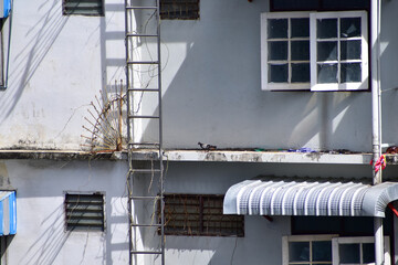 Close-up of the residential building in Bangkok, Thailand. Building exterior. Bangkok cityscape, street scene. Travel and cityscape concept.