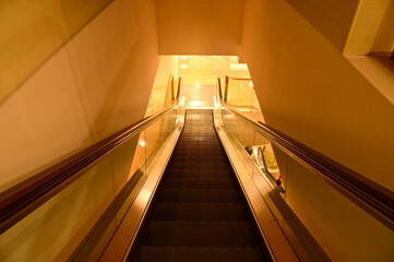 Close-up of the escalator. escalator convergence line. Indoor view.