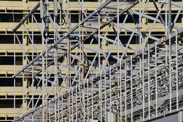 Metal scaffolding, used as temporary structure to support at the construction site. Construction concept. Construction equipment.