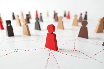 Colorful Human Figures Connected by Dotted Lines on a White Background, Representing Social Networking, Teamwork, Leadership, Diversity, and Community Structure in a Digital Concept