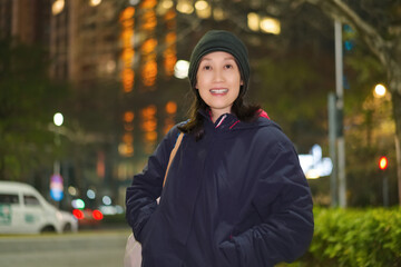 Asian Woman Outdoors at Night