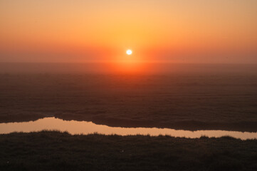 Obraz premium Sunrise Over Swamps of Mont Saint-Michel, Normandy