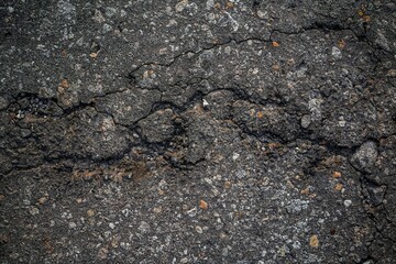 Cracked and worn asphalt surface, a testament to the passage of time.