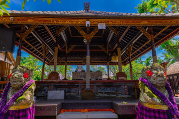 Ubud Bali is a very historical and religious cultural city with statues of Hindu Gods and ornate decorated buildings and doors. Balinese revere their gods in Bali Indonesia 