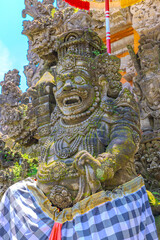 Ubud Bali is a very historical and religious cultural city with statues of Hindu Gods and ornate decorated buildings and doors. Balinese revere their gods in Bali Indonesia 