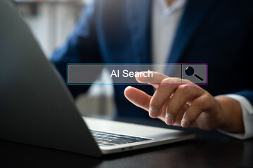 Fototapeta premium AI search technology revolution SEO, Businessman browsing internet using AI search tool to optimize content and improve ranking. SEO artificial intelligence for efficient data discovery.