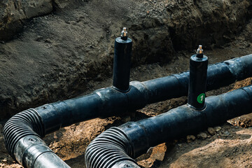 Underground Plastic Pipeline Installation in Construction Trench