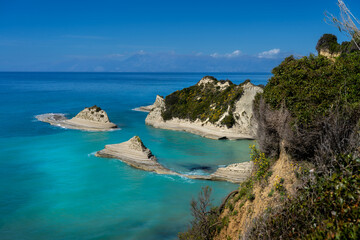 Fototapeta premium Discover the Stunning Coastal Landscape of Cape Drastis in Corfu, Greece – Turquoise Waters, Unique Rock Formations, and Breathtaking Cliffs Await Your Exploration