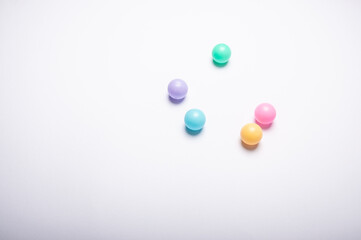 Colorful ball on a white background. No people. Flat lay.