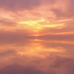 Obraz premium Sunset Over Calm Water with Golden Sky Reflection 