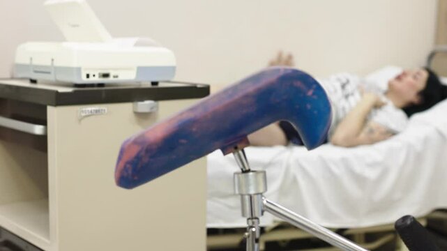 Close-up of a pregnant woman with an electrocardiograph. Checking the baby's condition before delivery. Fetal heart monitoring. Diagnostics, health care, medical services