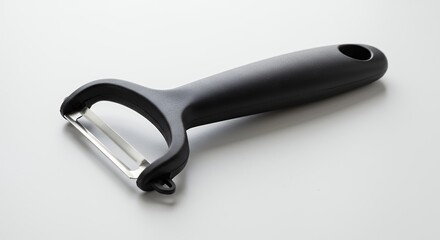 Obraz premium Black peeler on white background