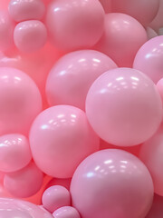 Close-up of glossy pink balloons forming an abstract bubbly texture perfect for festive, cheerful, or playful design backgrounds.